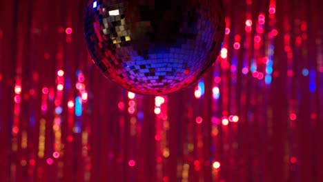 Close-Up-Of-Mirrorball-In-Night-Club-Or-Disco-With-Flashing-Strobe-Lighting-And-Sparkling-Lights-In-Background-4